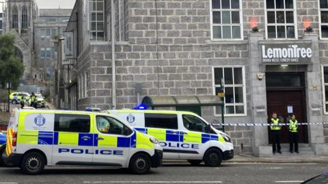 Police outside lemon tree