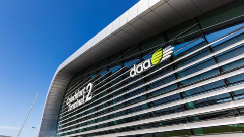 Terminal 2 at Dublin Airport from the outside. There's a clear blue sky. 