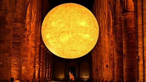 Art installation Helois - featuring detailed imagery of the sun's surface - pictured inside Fountains Abbey near Ripon.