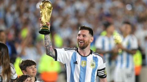 Lionel Messi of Argentina lifts the FIFA World Cup trophy