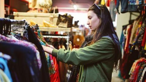 Woman shopping charity shop