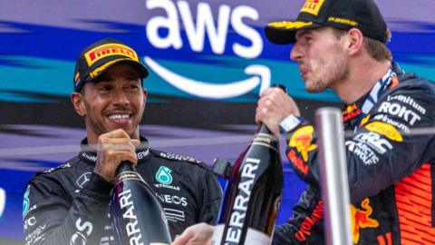 Max Verstappen and Lewis Hamilton celebrate after the Spanish Grand Prix