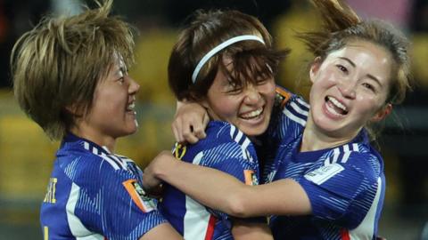 Japan's players celebrate after scoring against Spain at the Women's World Cup
