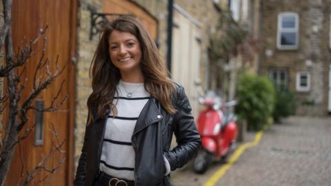 Bryony Hopkins standing in a residential street