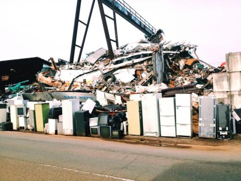 Rubbish heap of fridges, TVs and other electrical waste