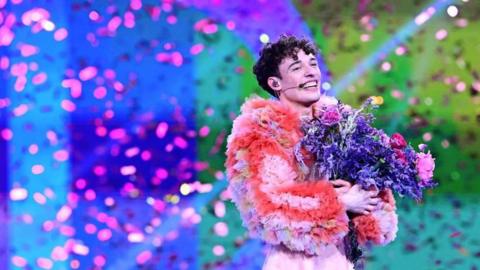 Swiss singer Nemo celebrates on stage after winning the final of the 68th Eurovision Song Contest
