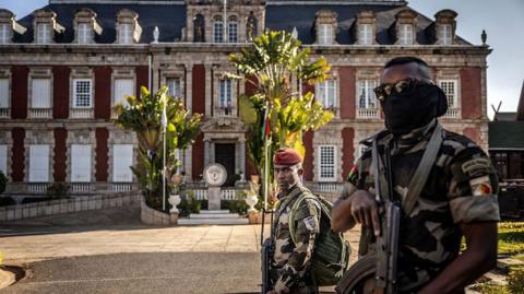 Members of the CAPSAT military unit outside the presidential palace in Antananarivo in Madagascar on 14 October. 