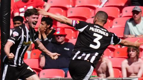 Lucas Ness celebrates scoring Notts County's second goal against Salford City