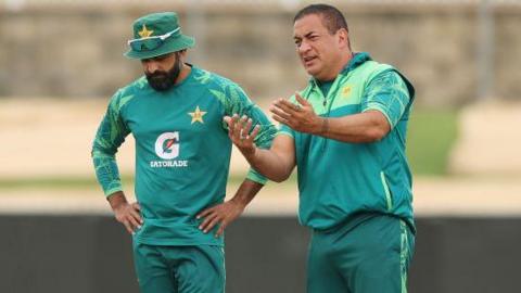 Adam Hollioake inspecting the wicket as Pakistan's batting coach