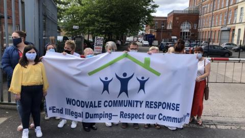 Residents protesting the suspected illegal dumping of waste at two sites in north Belfast