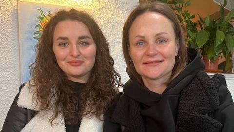 Hanna and Svitlana sitting with coffee in Lena's Ukrainian Kitchen in Hull city centre