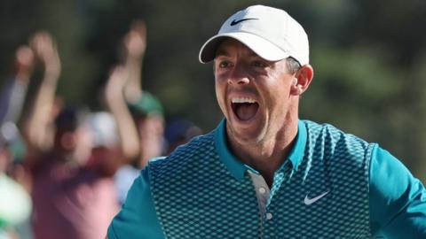 Rory McIlroy celebrates after chipping in on the 18th hole at the 2022 Masters