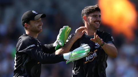 Josh Tongue and Jos Buttler celebrate a wicket