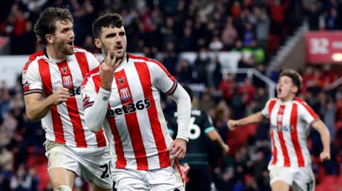 Tom Cannon celebrates scoring a hat-trick for Stoke City against Portsmouth 