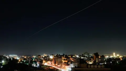 A streak of light, that appears to be an Iranian missile, taken from Hebron on June 7.