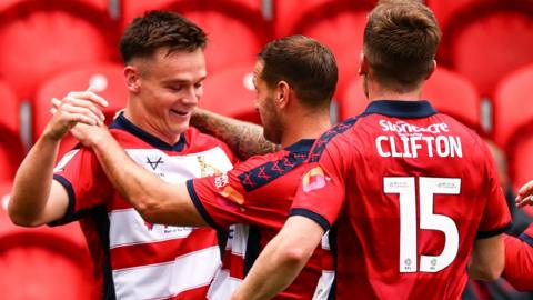 Owen Bailey celebrates scoring Doncaster's winner against Rotherham