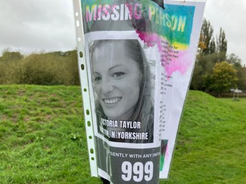 Missing poster attached to a lamppost