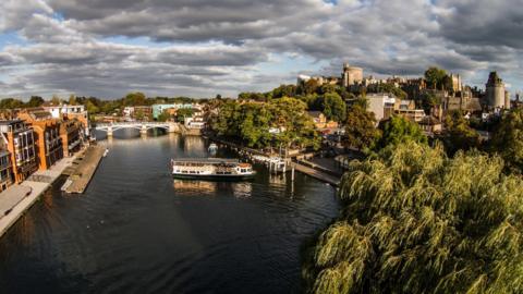 A general view of Windsor over the River Thames. Windsor Castle is on the right hand side, with flats on the left 