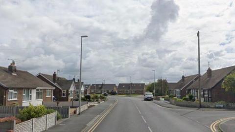 A suburban street of bungalows.