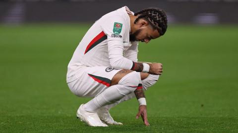 Chelsea defender Malo Gusto prays before match against Wolves in the Carabao Cup