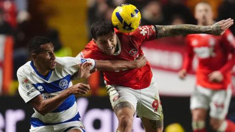 Charlton Athletic's Lyndon Dykes and Queens Park Rangers' Isaac Hayden battle for the ball