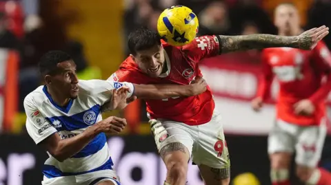 Charlton Athletic's Lyndon Dykes and Queens Park Rangers' Isaac Hayden battle for the ball
