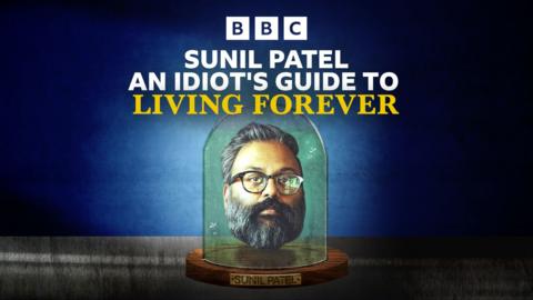 The head of a man with a beard and glasses under a belljar.