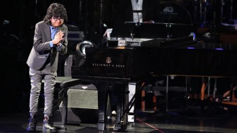 Joey Alexander performs at the 58th annual Grammy Awards