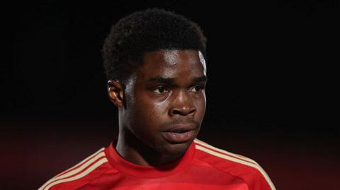 Kelly N'Mai wants to win the League Two play-offs with Salford.