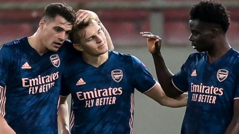 Martin Odegaard (centre) is congratulated after scoring