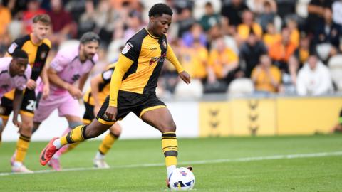 Newport's Bobby Kamwa takes a penalty