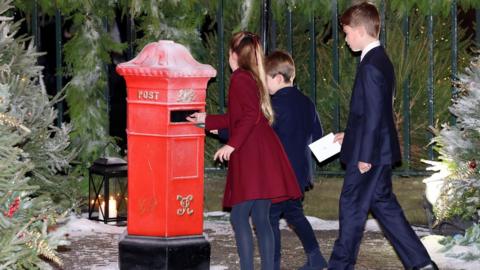 Princess Charlotte, Prince Louis and Prince George post letters ahead of the Royal Carols - Together At Christmas service at Westminster