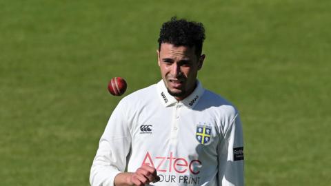 Codi Yusuf throwing a ball up during his spell with Durham.