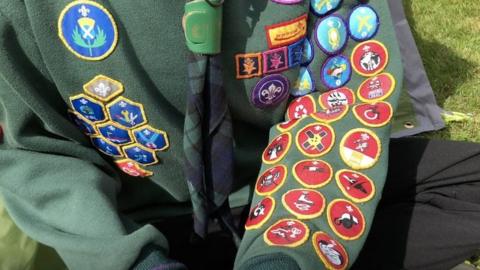 Gregor's Cub Scout jumper showing his badges