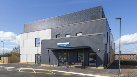 Outside shot of the new diagnostic centre. It's a modern, three-tiered building which is grey.