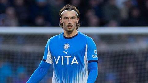 Brad Hills looking on in action for Stockport County