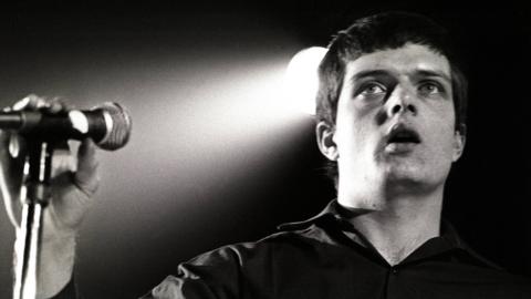 Joy Division singer Ian Curtis on stage in 1980