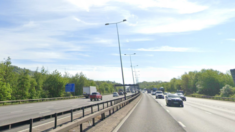 A general view of cars on the M25 motorway in Surrey between junctions 8 and 9