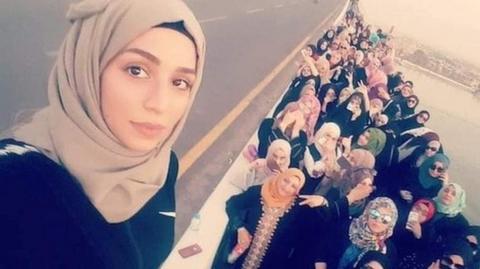 Riham Yaqoob leading a women's march (Twitter).