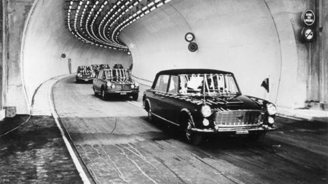 The party of the Italian President Giuseppe Saragat driving to the French side of the seven mile tunnel under Mont Blanc on 16th July 1965. 