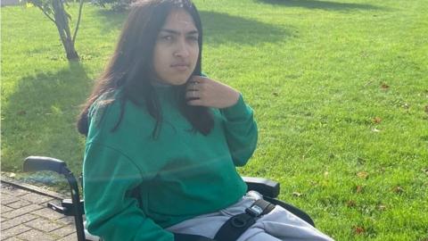 Alycia Ellis in her wheelchair outside New College