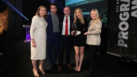 The BBC News team pictured with their award at the ceremony in Belfast's MAC