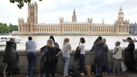 Members of the public join the queue on the South Bank, as they wait to view Queen Elizabeth II lying in state