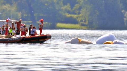 Carabinieri and fire brigade officers take part in the search and rescue operation in Lake Maggiore after a tourist boat capsized near Lisanza (Varese), northern Italy, 29 May 2023