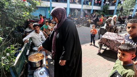 Palestinians fleeing Israeli attacks take shelter at UNRWA school in Khan Younis, Gaza on October 14, 2023