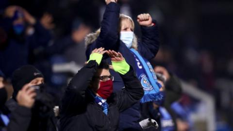 Wycombe fans react during their game with Stoke