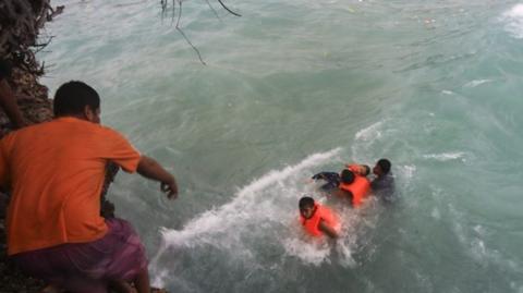 69 people were rescued and 40 people are missing after a ferry boat was hit by bad weather and capsized.