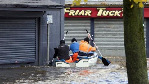 A boat was paddled up a flooded road in front of the Arts Centre in Newry on Tuesday morning
