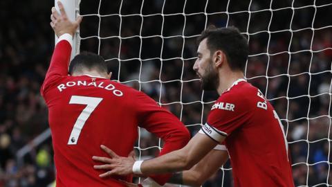 Bruno Fernandes comforts Cristiano Ronaldo after a miss