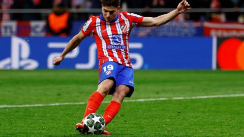 Atletico Madrid's Julian Alvarez scores a penalty during a shootout against Real Madrid which is later disallowed